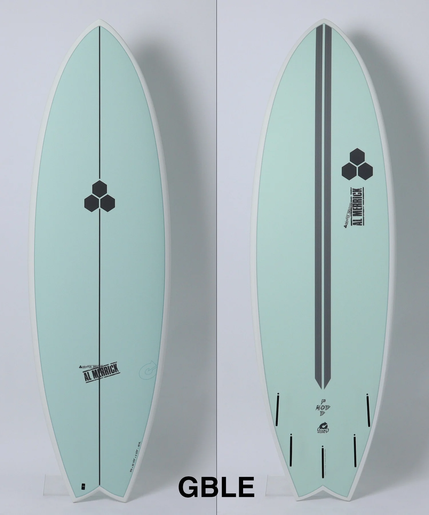 image - SHOP NEWS | ムラサキスポーツオンラインストア 通販 Two mint-green surfboards shown side by side, each with a central black line and small hexagon logo; left board plain, right board with logos along center.