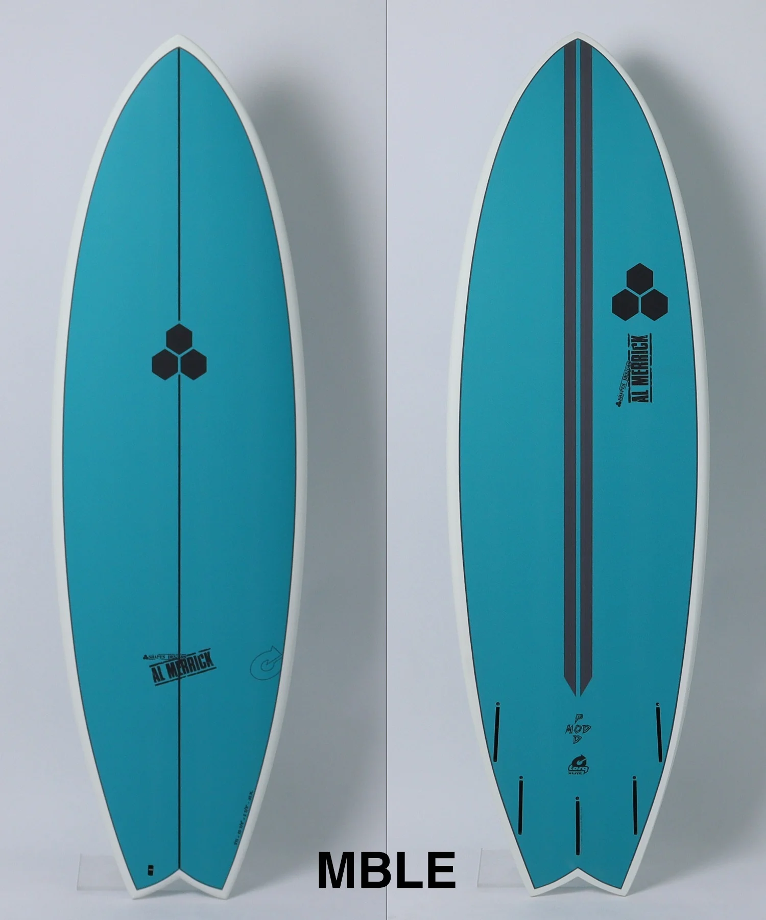 image - SHOP NEWS | ムラサキスポーツオンラインストア 通販 Two teal surfboards shown side by side against a white background, with a hexagonal logo centered on each board.