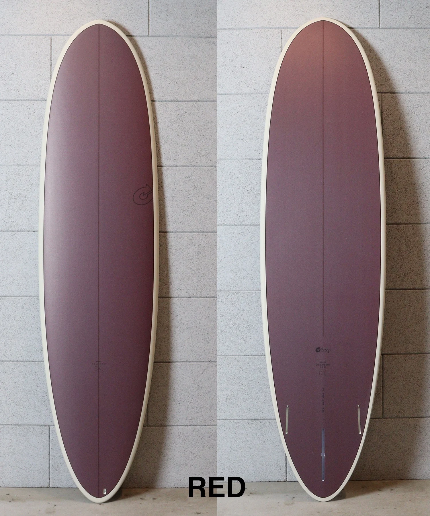 image - SHOP NEWS | ムラサキスポーツオンラインストア 通販 Two burgundy surfboards with cream rails photographed against a gray tile wall, shown side by side; the word RED appears at the bottom edge.